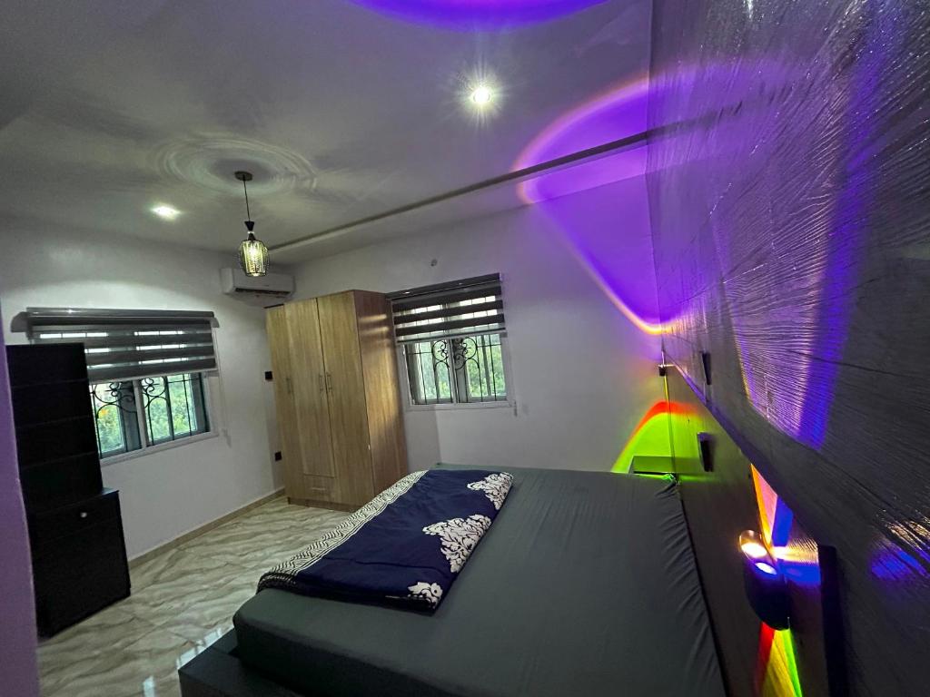 Postel nebo postele na pokoji v ubytování Abiodun Prime Apartment