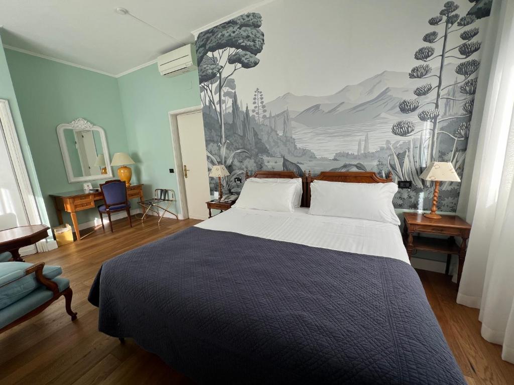 Postel nebo postele na pokoji v ubytování Hotel Fenix