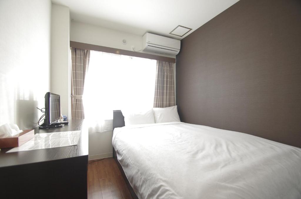 Postel nebo postele na pokoji v ubytování Hotel Imalle Haneda