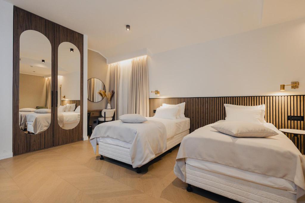 Postel nebo postele na pokoji v ubytování Hotel Flaneur
