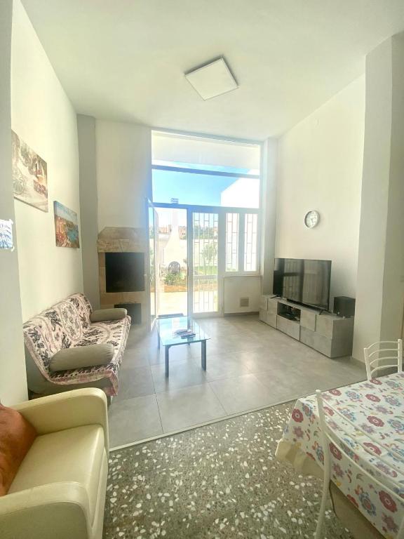 TV a/nebo společenská místnost v ubytování House Malù apartment