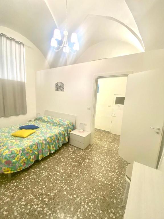 Postel nebo postele na pokoji v ubytování House Malù apartment