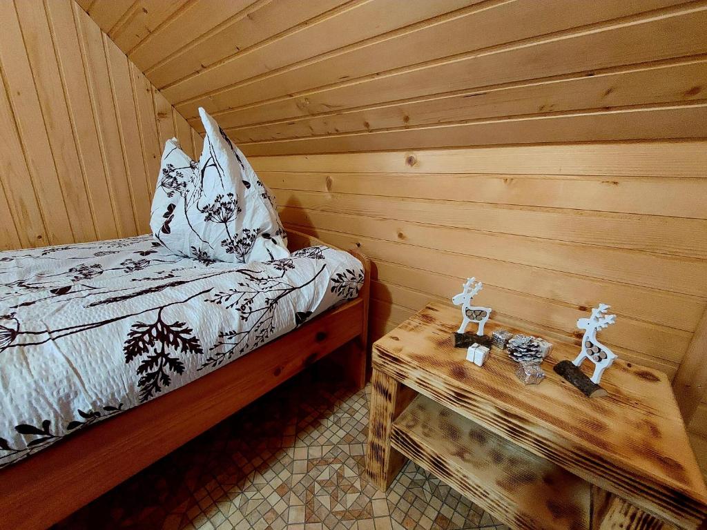 Postel nebo postele na pokoji v ubytování Koča Lipa pod Veliko planino