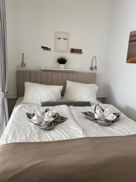 Letto o letti in una camera di Rosebeach Appartement am Ossiachersee und Gerlitzen Skipiste
