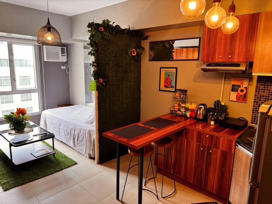 Condo at Avida Towers Riala T2 Bright, Cozy Studio with a Touch of Nature
