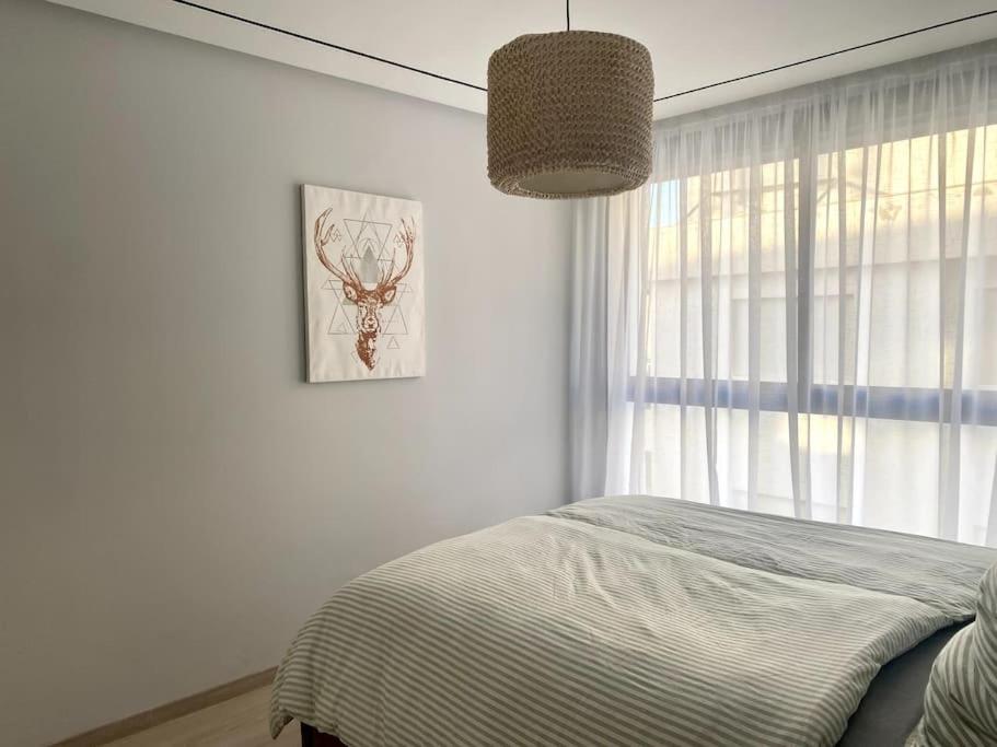Ένα ή περισσότερα κρεβάτια σε δωμάτιο στο Appartement en résidence Malabata Hills