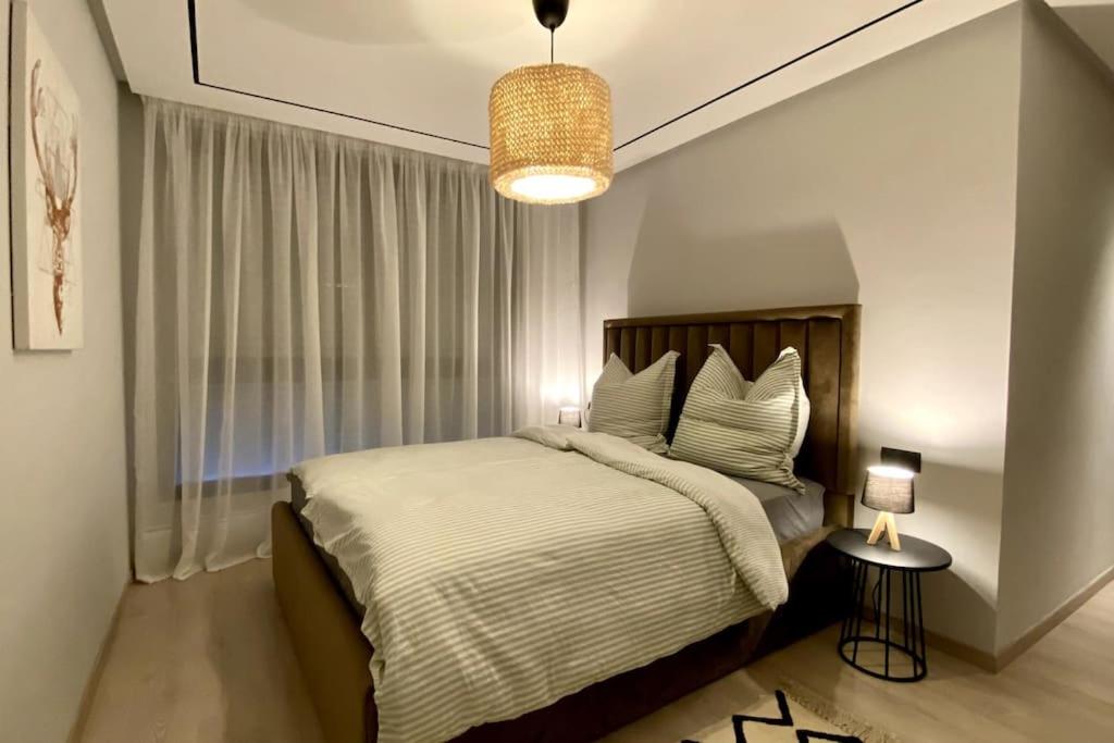 Ένα ή περισσότερα κρεβάτια σε δωμάτιο στο Appartement en résidence Malabata Hills