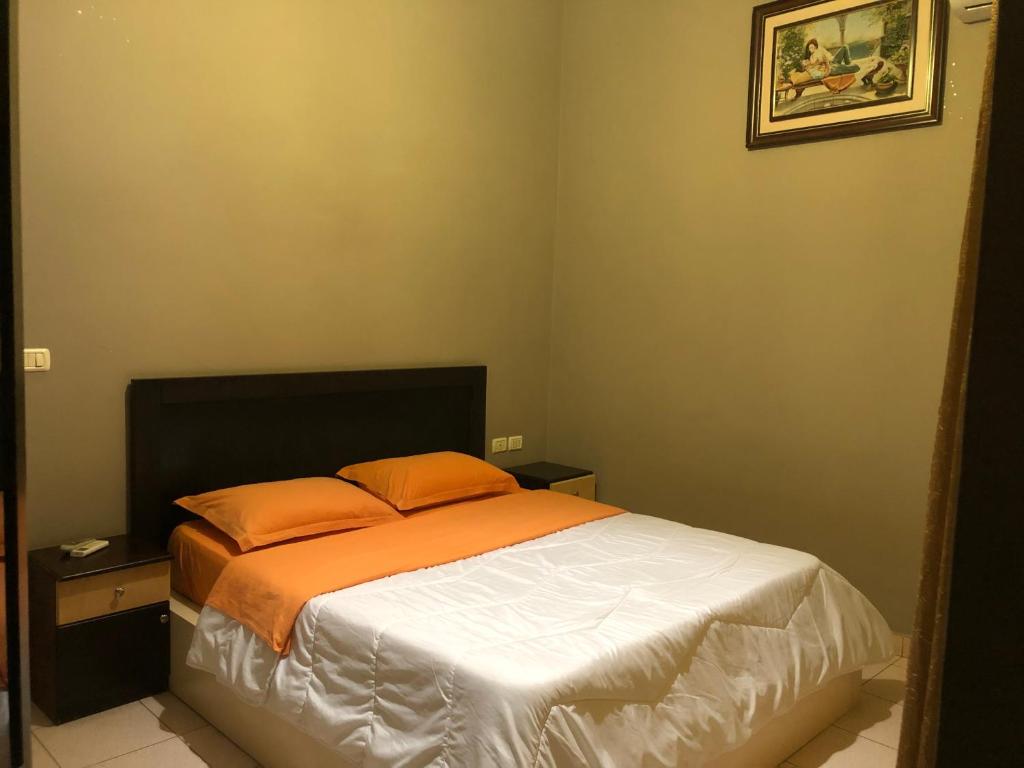 Postel nebo postele na pokoji v ubytování Hotel Xhej