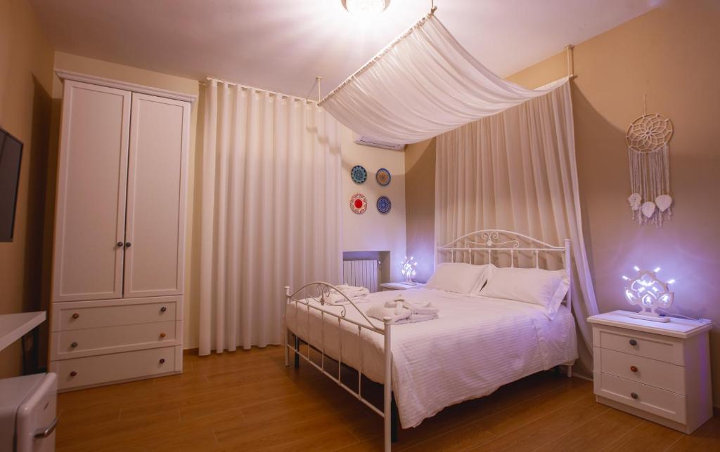 Postel nebo postele na pokoji v ubytování Alle Luminarie