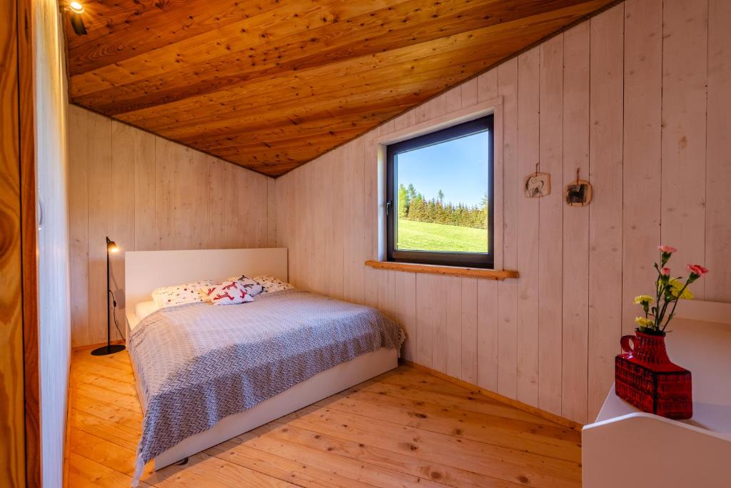 Postel nebo postele na pokoji v ubytování Domek Trohaniec Leśny