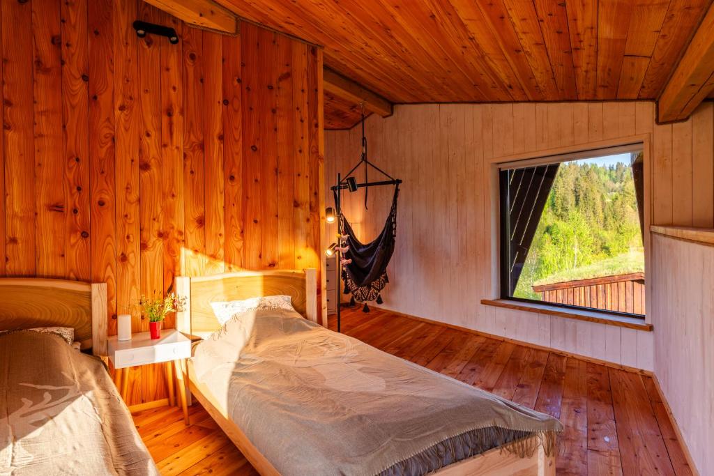 Postel nebo postele na pokoji v ubytování Domek Trohaniec Leśny