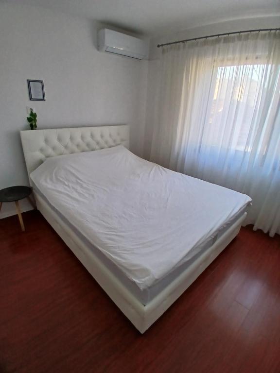 Postel nebo postele na pokoji v ubytování Apartmani Zaara