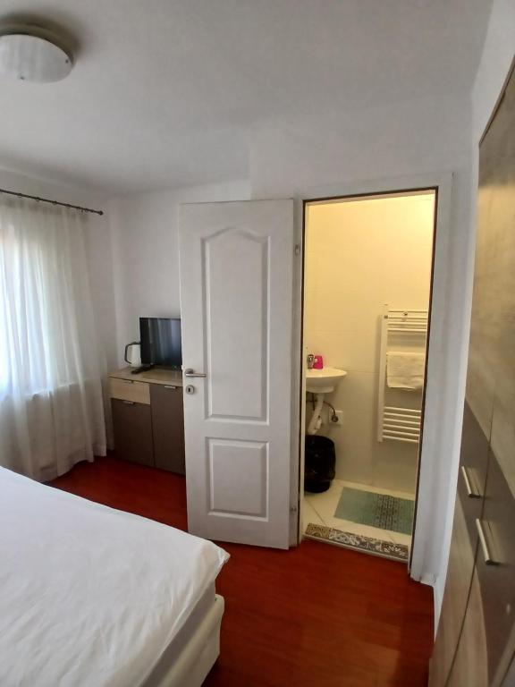 Postel nebo postele na pokoji v ubytování Apartmani Zaara
