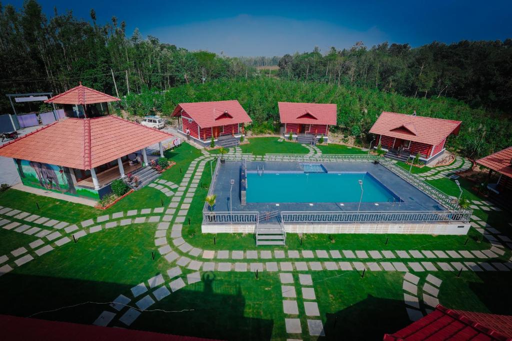 an aerial view of a house with a swimming pool at Mountain Peak Resort in Hassan
