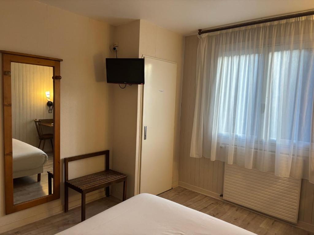 Postel nebo postele na pokoji v ubytování Auberge de Costaroche