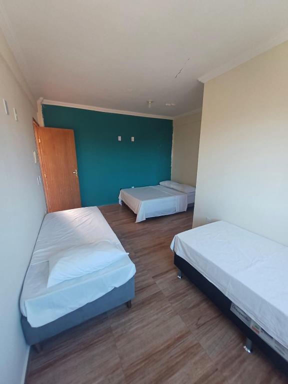 Postel nebo postele na pokoji v ubytování Pousada Estrela Mares Suíte 308