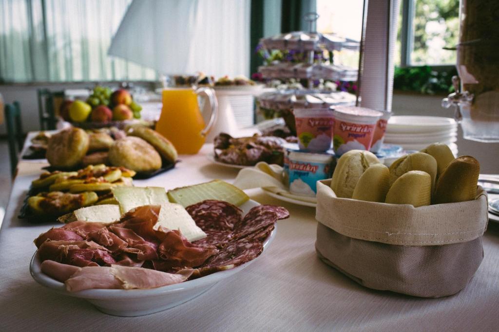 a table with a bunch of different types of food at Hotel Royal in Giulianova