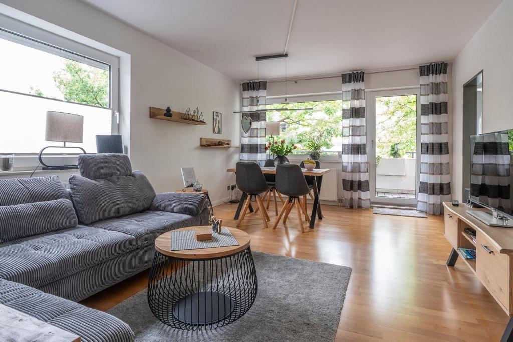a living room with a couch and a table at AUSZEIT in Bad Zwischenahn