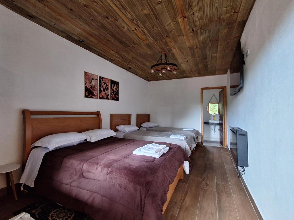 Postel nebo postele na pokoji v ubytování Recanto Ursa Maior