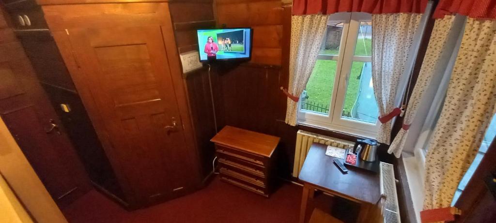 TV a/nebo společenská místnost v ubytování Hotel Diana