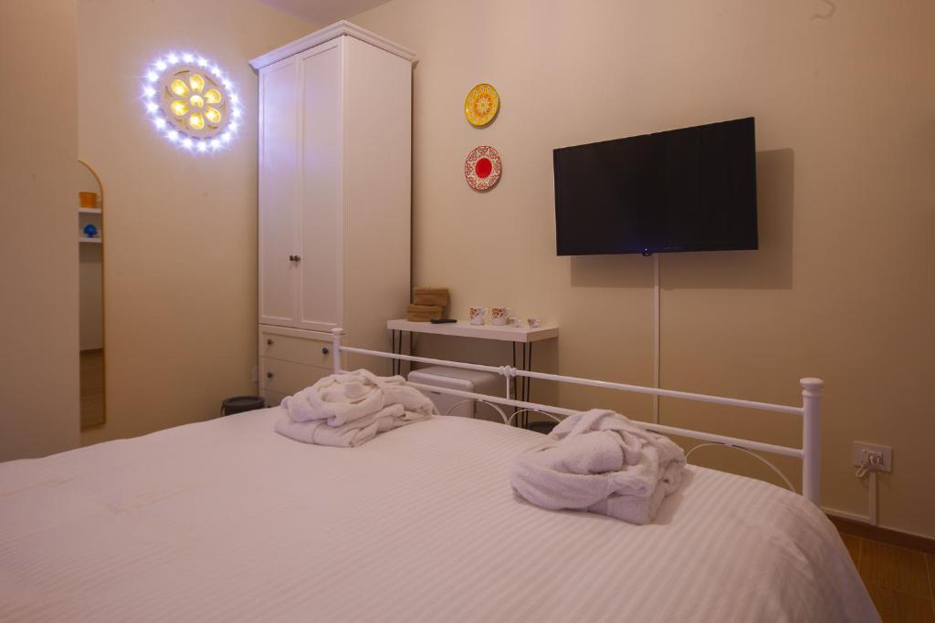 Postel nebo postele na pokoji v ubytování Alle Luminarie