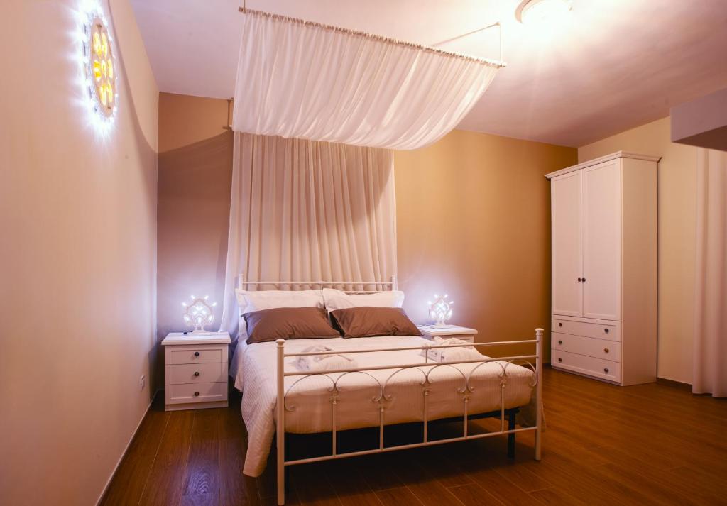 Postel nebo postele na pokoji v ubytování Alle Luminarie