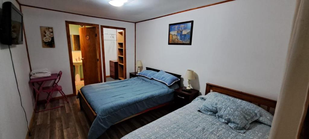 Postel nebo postele na pokoji v ubytování Hotel Cordillera Cabildo