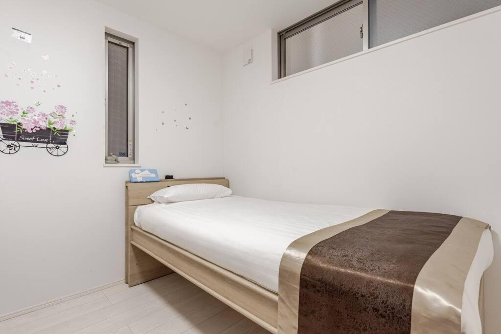 Postel nebo postele na pokoji v ubytování 山手線田端駅から徒歩5分、とても便利な場所です