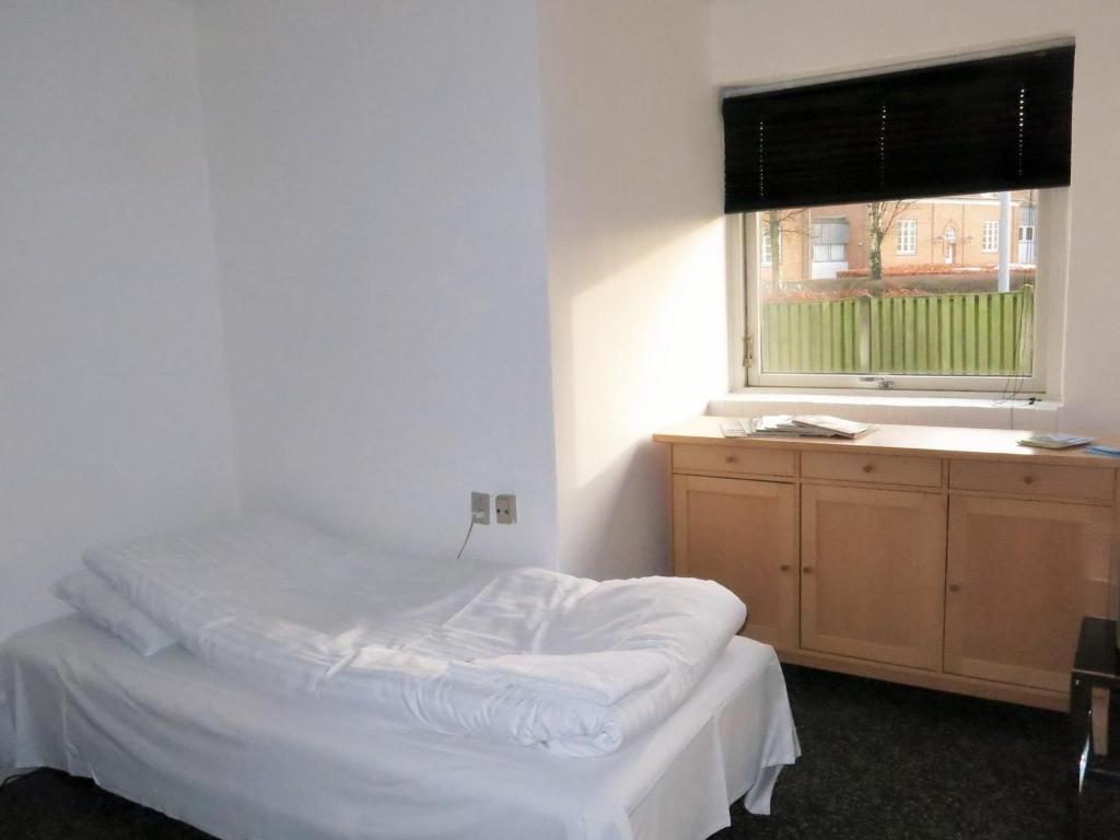 Postel nebo postele na pokoji v ubytování Centrum Sleepover