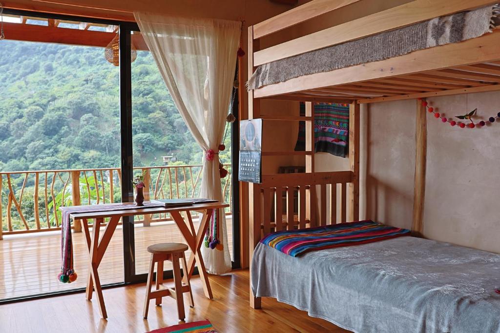 Postel nebo postele na pokoji v ubytování Casa Awänímä - Boutique Eco-Lodge