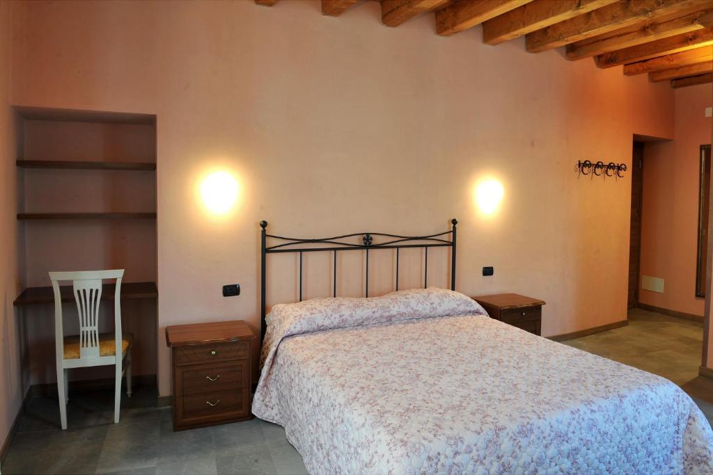Postel nebo postele na pokoji v ubytování B&B Sant'Antonio De Foris