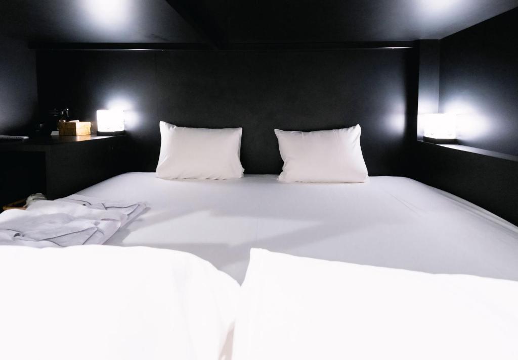 Postel nebo postele na pokoji v ubytování HOTEL TRAD Replay