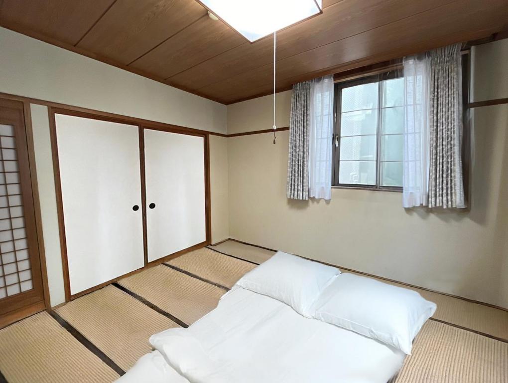 Postel nebo postele na pokoji v ubytování Wonderwall美好境界 日本苗場館