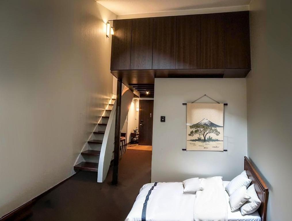 Postel nebo postele na pokoji v ubytování Wonderwall美好境界 日本苗場館