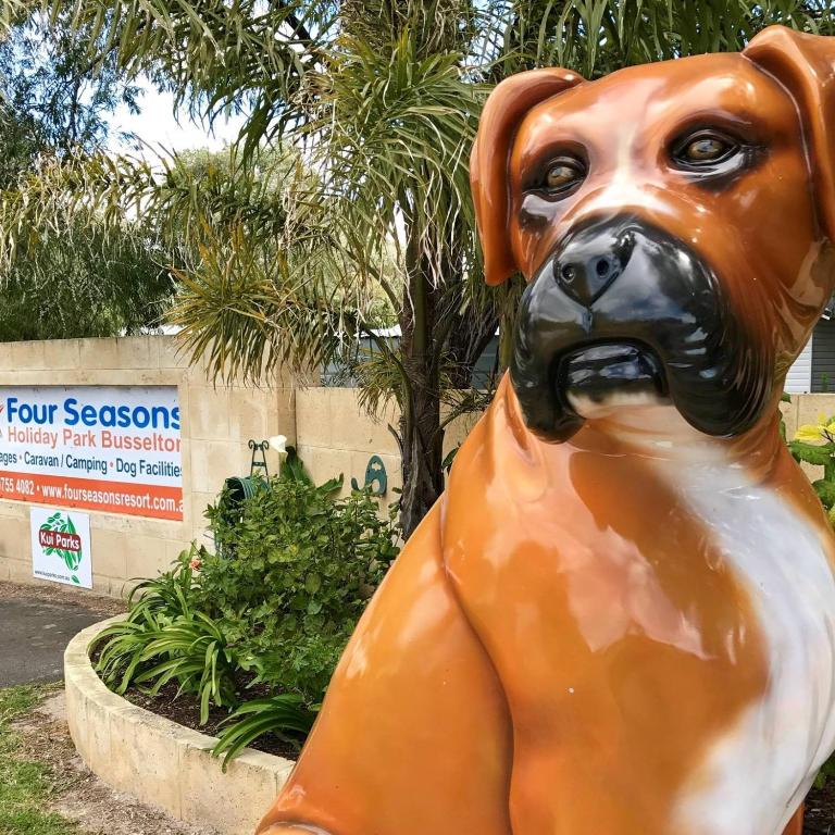 a statue of a dog sitting in a park at Four Seasons Holiday Park in Marybrook