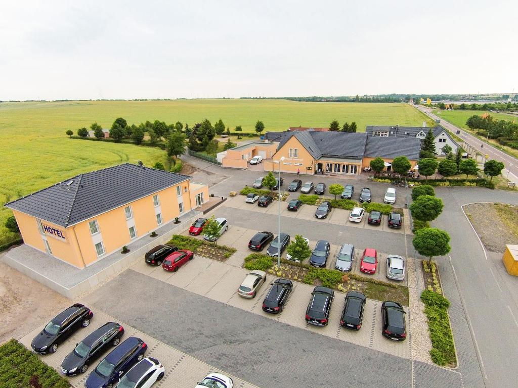 an aerial view of a parking lot in front of a building at Landhaus Bennstedt in Bennstedt