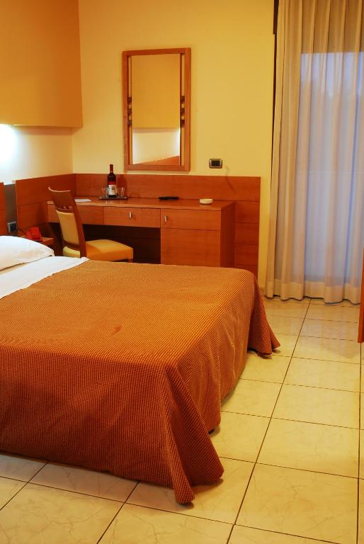 Postel nebo postele na pokoji v ubytování Hotel Club Astor