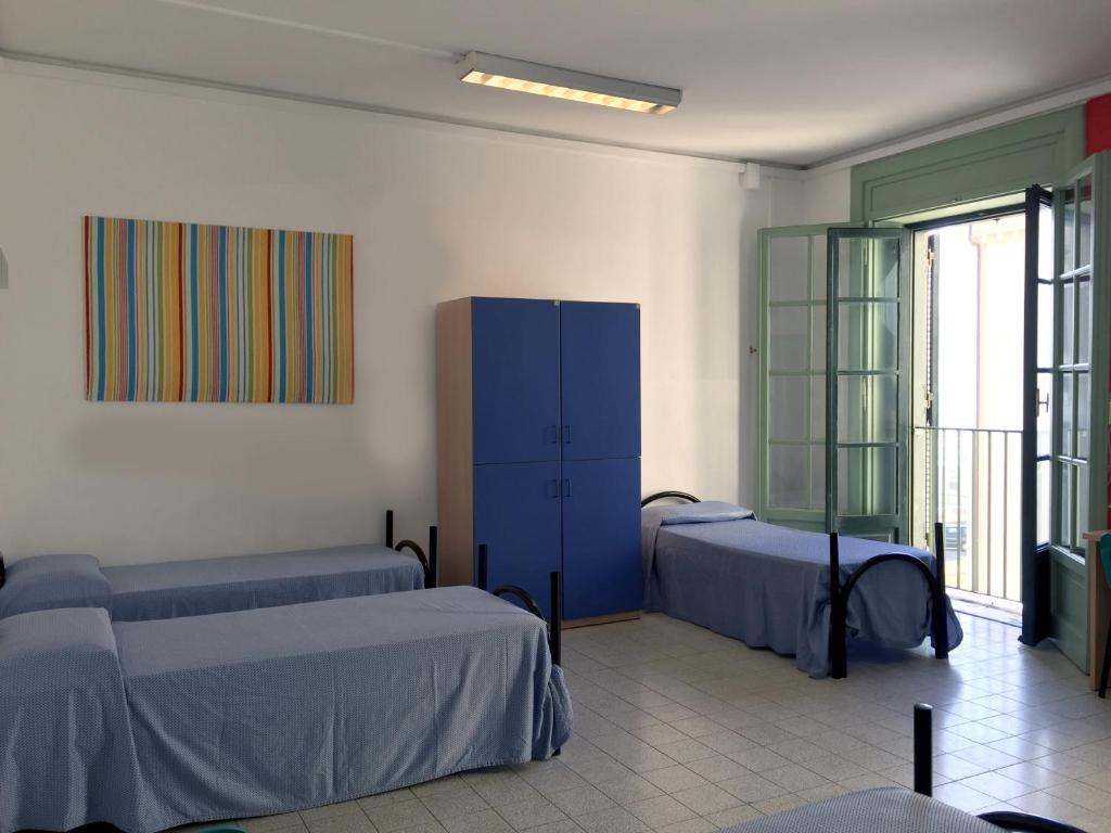 Postel nebo postele na pokoji v ubytování Litus Roma Hostel