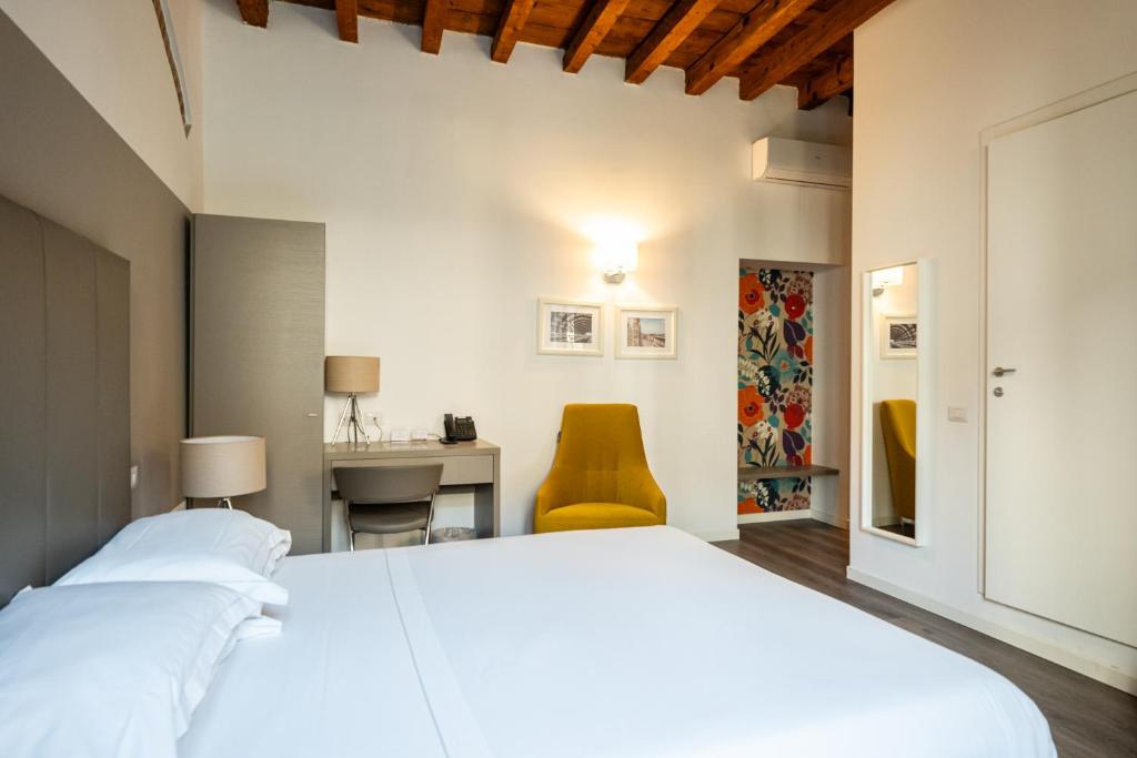 Postel nebo postele na pokoji v ubytování Ai Suma Hotel