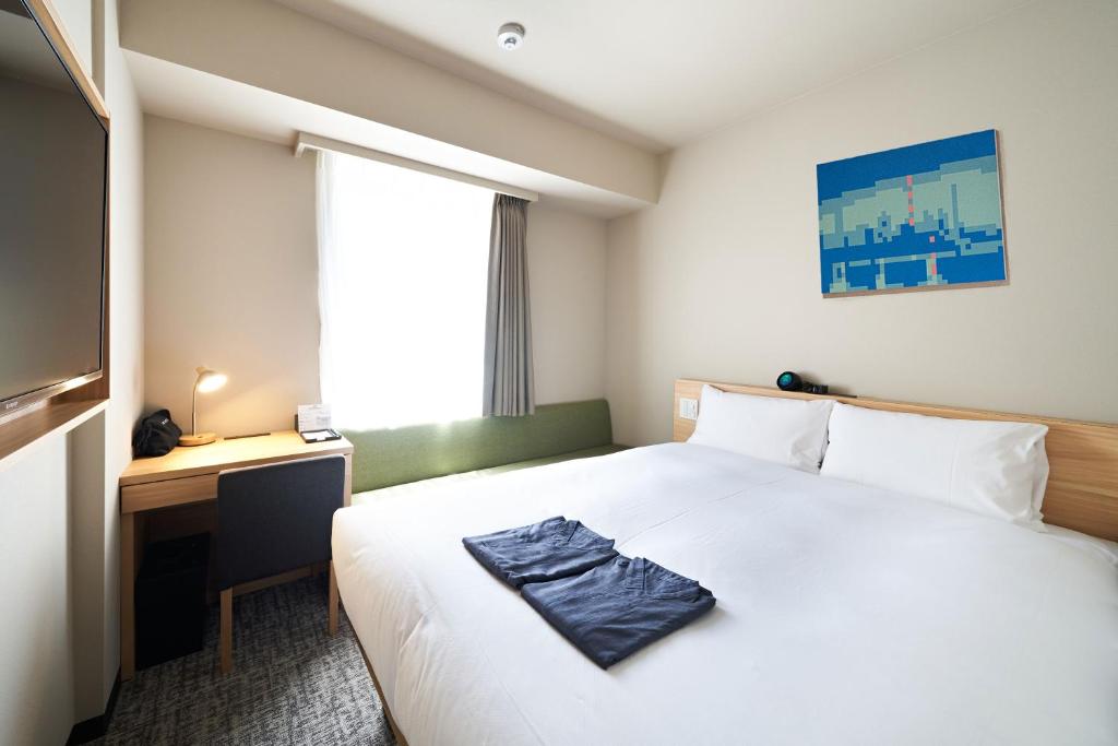 Postel nebo postele na pokoji v ubytování HOTEL Enmichi