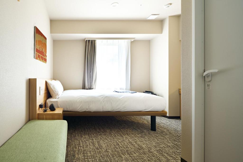 Postel nebo postele na pokoji v ubytování HOTEL Enmichi