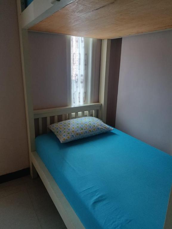 Postel nebo postele na pokoji v ubytování gigafa homestay