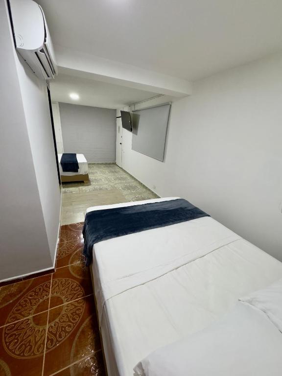 Postel nebo postele na pokoji v ubytování Hotel Estadio 80