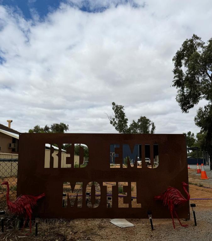 a sign that saysmed end of the world at Red Emu Motel in Perenjori