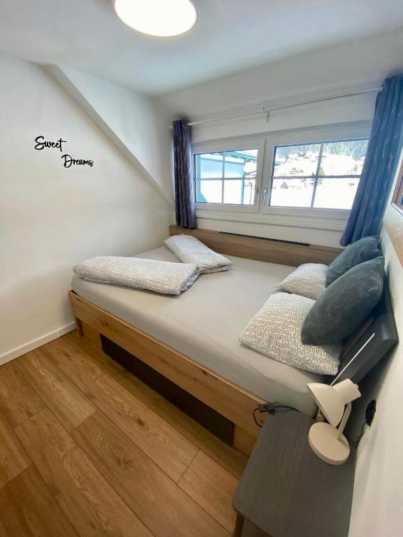 Posteľ alebo postele v izbe v ubytovaní Das Almsternderl - gemütliche Wohnung in Gosau