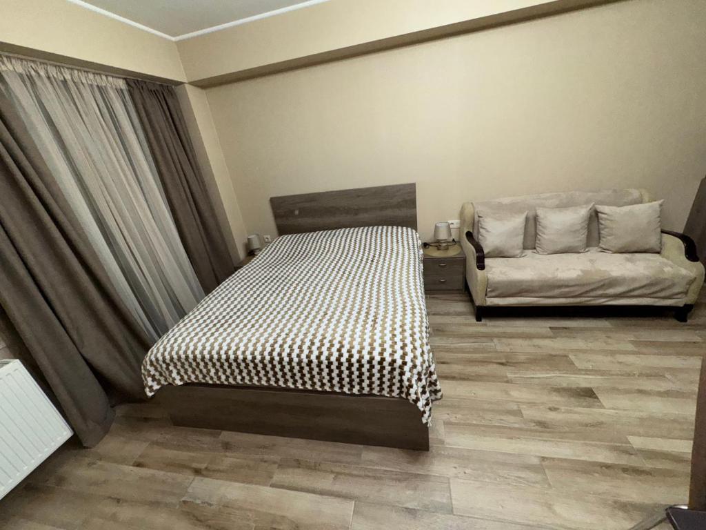 Postel nebo postele na pokoji v ubytování Giorgi Apartment In New Gudauri - Block 3 - N315