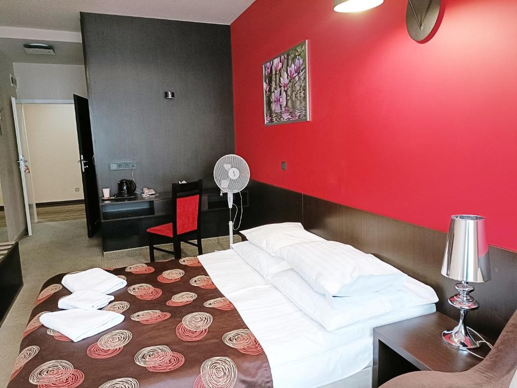 Postel nebo postele na pokoji v ubytování Hotel Ajax