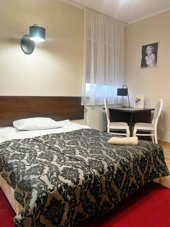 Postel nebo postele na pokoji v ubytování Hotel Ajax