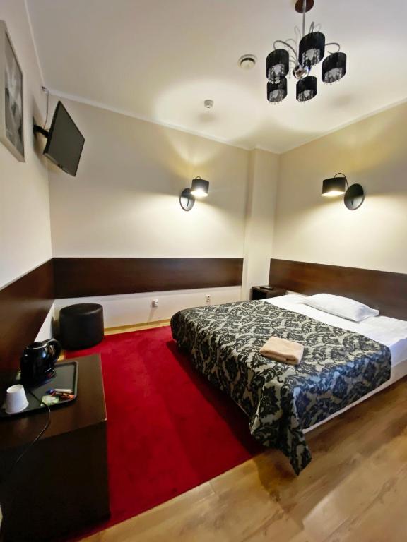 Postel nebo postele na pokoji v ubytování Hotel Ajax