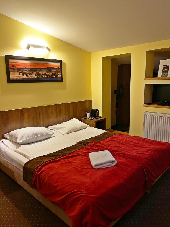 Postel nebo postele na pokoji v ubytování Hotel Ajax